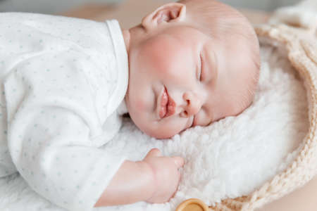 Reborn doll boy sleeps on his stomach. close-upの写真素材