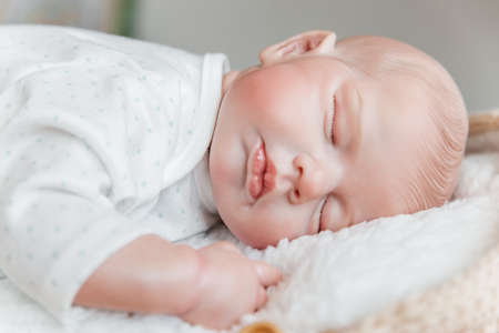 Reborn doll boy sleeps on his stomach. close-upの写真素材