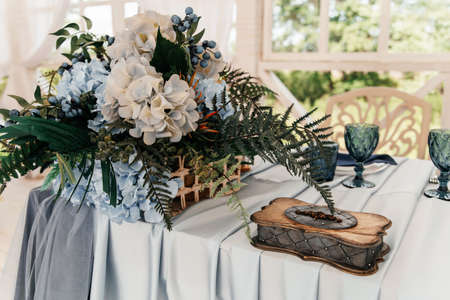 Wedding table of the bride and groom, decorated in blue and blue tones.の写真素材