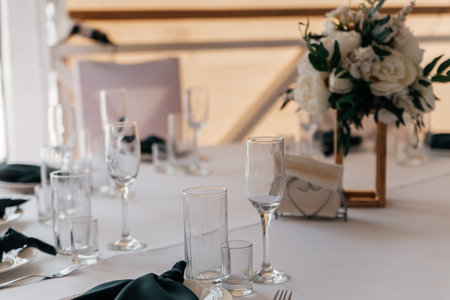 Serving and decor of the wedding round table on the outdoor veranda.の写真素材