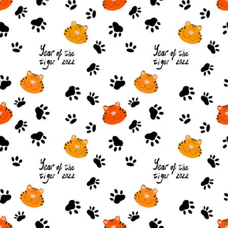 Seamless pattern. Tigers, footprints and inscriptions on a white background. The year of the tiger is 2022.の写真素材