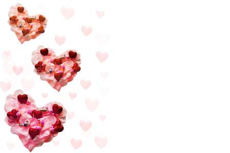 Three pink hearts with birds and flowers on a white background. Valentine's Day card.