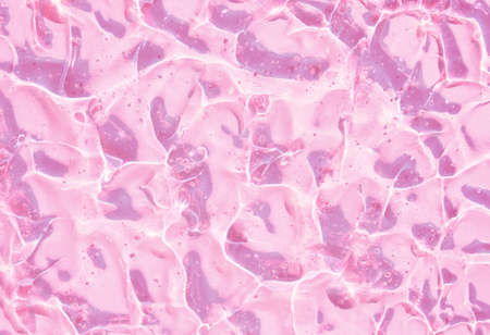 texture gel serum on pink background smear gel texture swatchの写真素材