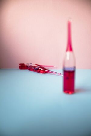 Ampoules with antibiotics, close-up. Medical ampoules, infusion and syringe injection on white background with copy space. Vial Drug Vaccine Plastic Syringe with Needle and medicine tablet. Healthcareの写真素材