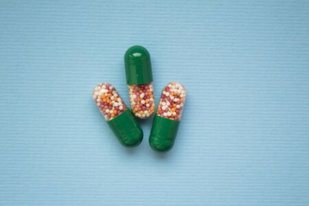 granulated tablets on a classic blue background