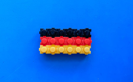 German flag on a blue background, built from a children toy constructionの写真素材