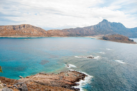 Beautiful Mediterranean summer landscape, birds eye view. Mountains and rocks, turquoise water in the bay. Gramvousa island, Crete, Greece.の写真素材