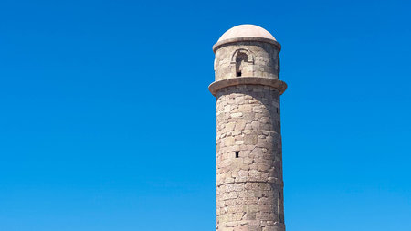 Sunny Mediterranean lighthouse above Patara, bright blue sky, perfect coastal view, iconic summer escape, serene seaside landmark for travel and vacation inspiration.の写真素材