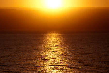 Golden sunrise over the mountains and the Dead Seaの写真素材