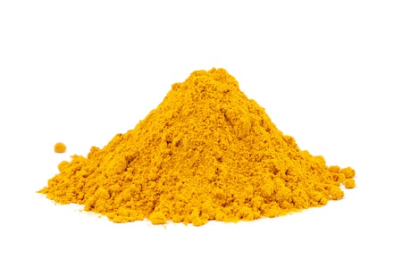 Heap ground Curry  Madras Curry  isolated on white background  Used as a spice in cuisines all over the world の写真素材