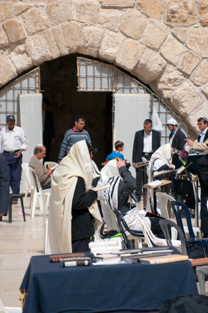 JERUSALEM, ISRAEL - MARCH 14, 2006  Men pray at the Wailing Wall  The Western Wall, Wailing Wall or Kotel is located in the Old City of Jerusalem at the foot of the western side of the Temple Mount のeditorial素材