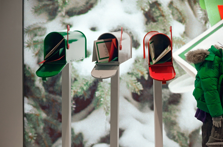 MUNICH, GERMANY - DECEMBER 25, 2009: Fashion store's shop window. Dressed man mannequins in a fashion store's shop window decorated for Christmas. Munich, Germany.のeditorial素材