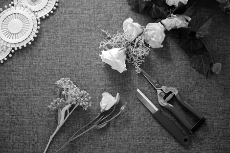 Florist workplace. Tools and accessories. Flowers, pruner, knife, pinsの写真素材