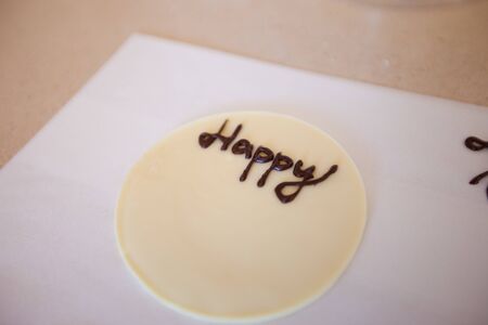 Greeting celebration happy birthday. Chocolate inscription. Decorations on the cake.の写真素材
