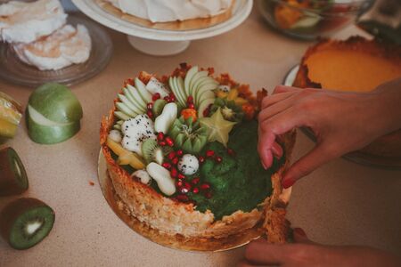 Process of cookingÂ cake with fresh fruits