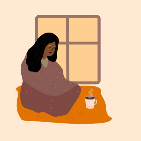 Black Woman wrapped in cozy blanket is sitting next to teacup. Warm blanket Vector illustration. Afro-American is lonely sad. Cold evening at home.のイラスト素材