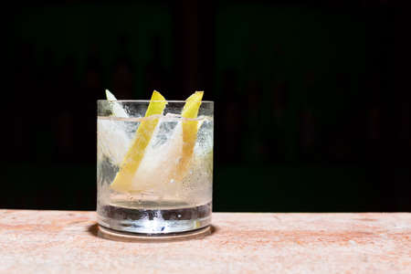 Glass of peach mojito on marble tableの写真素材