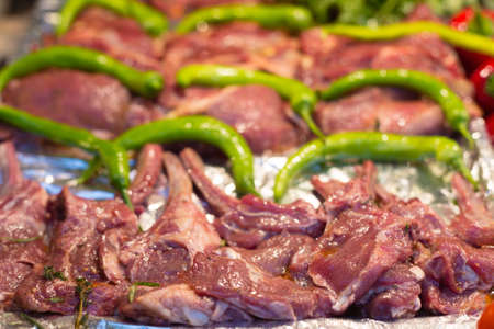 lamb chops on a display in an open buffet restaurantの写真素材