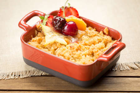 Apple crumble on a wooden background. Horizontal, warm colorの写真素材