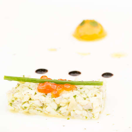Sea bass ceviche with ginger, salmon caviar, mango puree and pesto sauce. European cuisine. Squareの写真素材