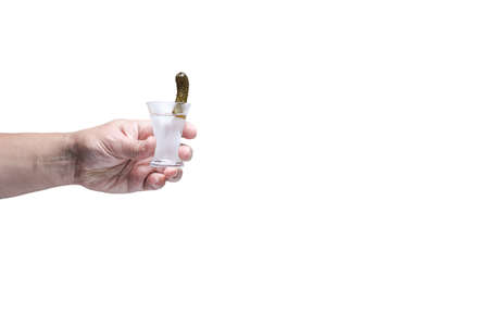 Drink responsibly!  Adult hand with shot of vodka. Isolated on white. Horizontalの写真素材