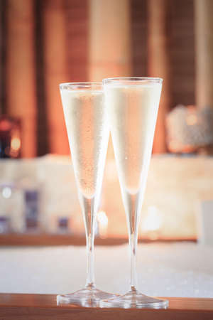 Two glasses of champagne near hot tub. Valentines background. Romance concept. Vertical, tonedの写真素材