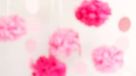 Paper flowers at the girl baby shower party. Baby shower celebration concept. Festive party background. Horizontal, wide screen formatの写真素材