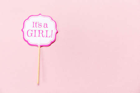 It's a girl sign at the baby shower party.  Pink solid background. Baby shower celebration concept. Minimalistic party background. Horizontal Top viewの写真素材