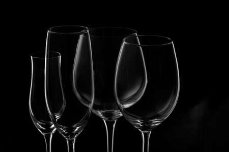 Glassware selection with wine, champagne and liquour glasses on the dark background.. Fine cristal glassware concept. Horizontalの写真素材