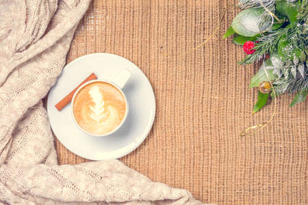 Cup of coffee or chai tea with latte art.  Christmas decor. Holiday bachground. Christmas and leisure time concept. Pastel colors, warm toning. Horizontalの写真素材