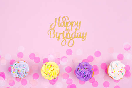 Creative pastel fantasy holiday card with cupcake and happy birthday lettering. Baby shower, birthday, celebration concept. Horizontalの写真素材