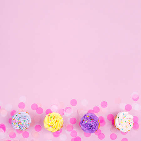 Creative pastel fantasy holiday card with cupcake and confetti. Baby shower, birthday, celebration concept. Squareの写真素材