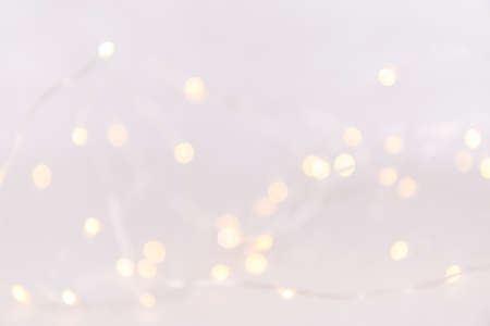 White background with bokeh lights. Holiday Christmas and New Year background. Horizontal