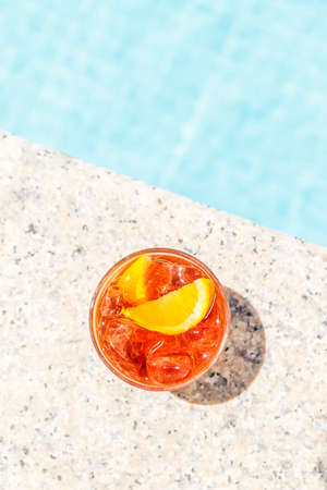 Negroni cocktail  near a pool at the resort bar or suite patio. Luxury resort, vacation, room...