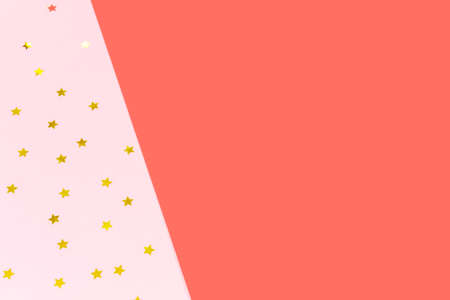 Golden star sprinkles on double pink and blue. Festive holiday background. Celebration concept. Top...