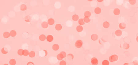 Creative pastel fantasy holiday card with pink party confetti. Baby shower, birthday, celebration concept. Horizontal, banner, wide screen format. Living coral theme - color of the year 2019の写真素材