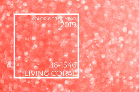 Blurred glitter golden background for holiday and any project. Shallow depth of field. Horizontal. Living coral theme - color of the year 2019の写真素材
