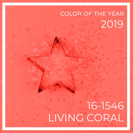 Flatlay with star cookie cutter and snowflake sprinkles on blue background. Holiday, Christmas and New Year concept. Cozy homey details. Square. Living coral theme - color of the year 2019の写真素材