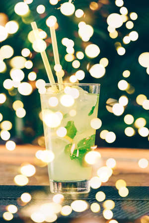 Lemonade at the bar stand. Luxury vacation concept. Vertical. Bold festive bokehの写真素材