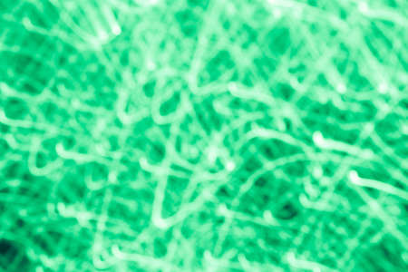 Futuristic blurred lights holiday monochrome background in mint green. Horizontal, soft focusの写真素材