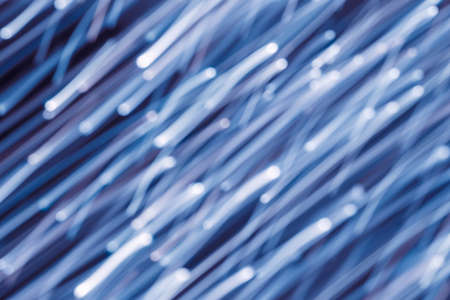 Futuristic blurred lights holiday monochrome background in dark blue. Horizontal, soft focusの写真素材