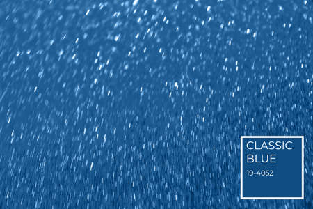 Blurred glitter blue background with color tag for holiday and any project. Shallow depth of field. Horizontalの写真素材