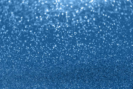 Blurred glitter blue background for holiday and any project. Shallow depth of field. Horizontalの写真素材