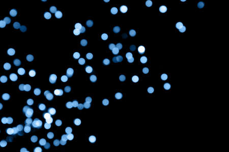 Black background with classic blue bokeh lights. Holiday, Christmas and New Year background. Horizontalの写真素材