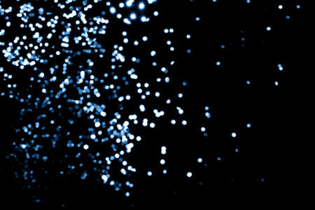 Black background with classic blue bokeh lights. Holiday, Christmas and New Year background. Horizontalの写真素材