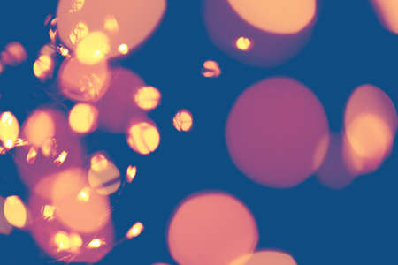 Classic blue background with soft pastel bokeh lights. Holiday, Christmas and New Year background. Horizontalの写真素材