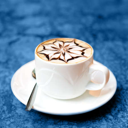 Cappuccino cup on marble background, toned in blue. Squareの写真素材