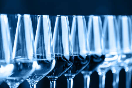 Wine glasses in a row. Buffet table celebration of wine tasting. Nightlife, celebration and entertainment concept. Horizontalの写真素材