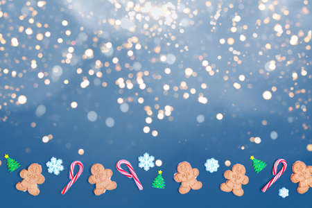 Christmas sweet treats pattern background on classic blue. Flat lay holiday concept. Horizontal