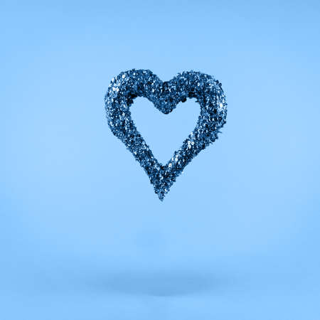 Glitter heart on classic blue background. Valentines day and love concept. Square.の写真素材